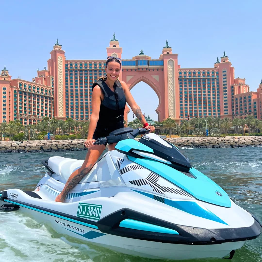 Yamaha VX 1050 jet ski on the water with the Dubai skyline behind — photo 1