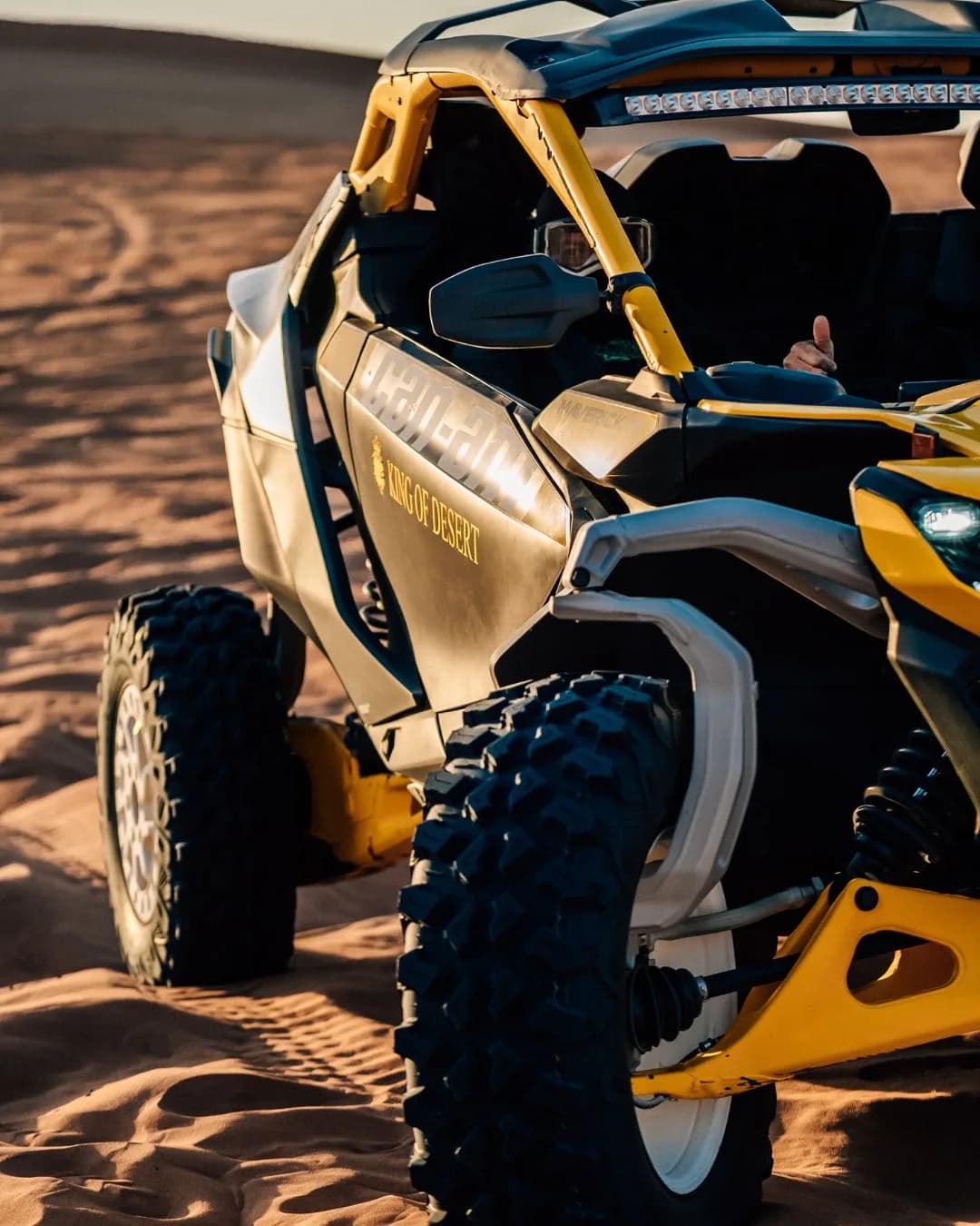 Close-up side view of the Can-Am Maverick R in King of Desert colors